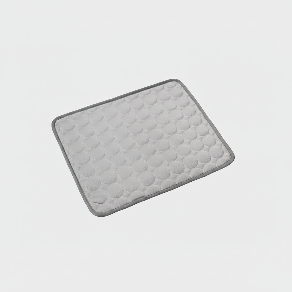 Gray bed mat with textured surface on a white background