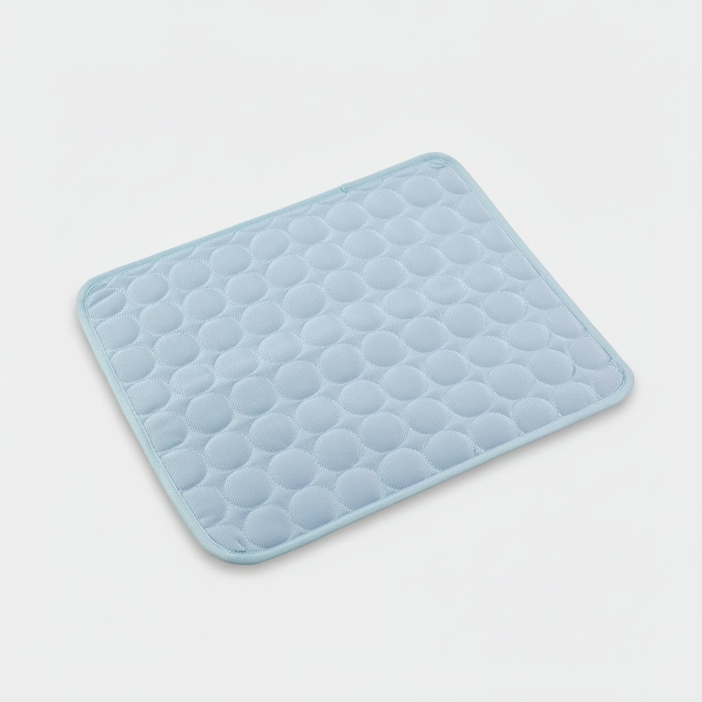 Light blue quilted bath mat on a white background